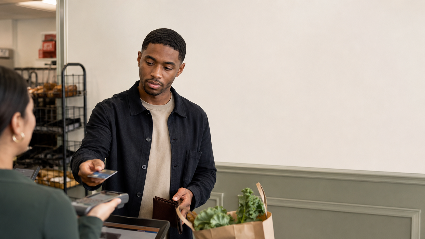 Young Black professional making a planned purchase with space for a teaching timeline showing purchase, statement, grace period, due date, and payment in full.